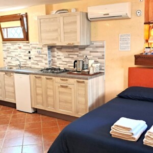Alloggio Gladiolo - Cucina e Letto da TV 01